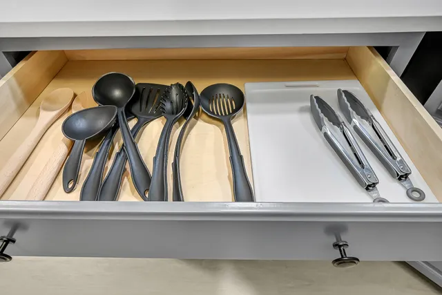 a living room with a large fireplace and a large window