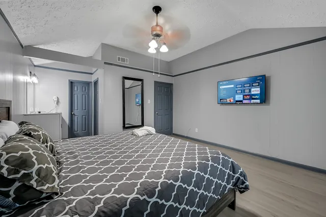 a bathroom with a sink vanity and a mirror