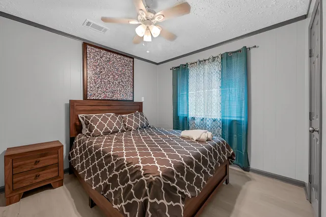 a view of a backyard with table and chairs and a fire pit