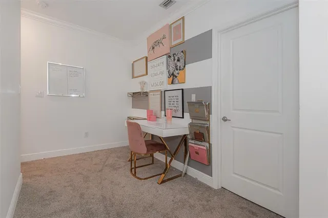 a view of a room that has a table and chairs in it