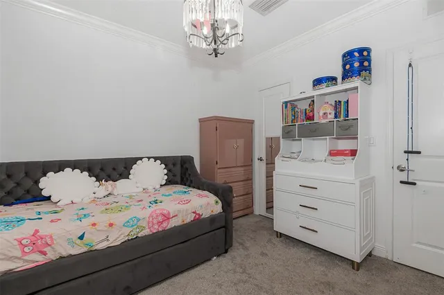 a bedroom with a bed and cabinets
