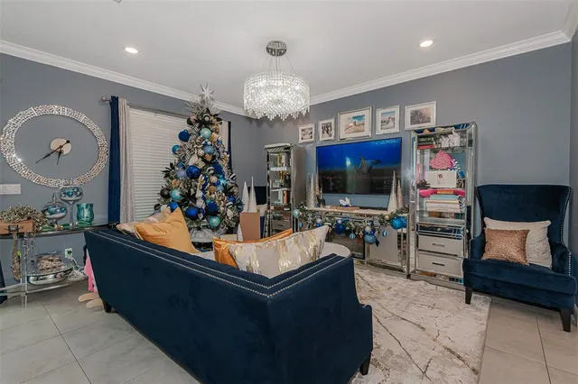 a living room with fireplace furniture and a flat screen tv