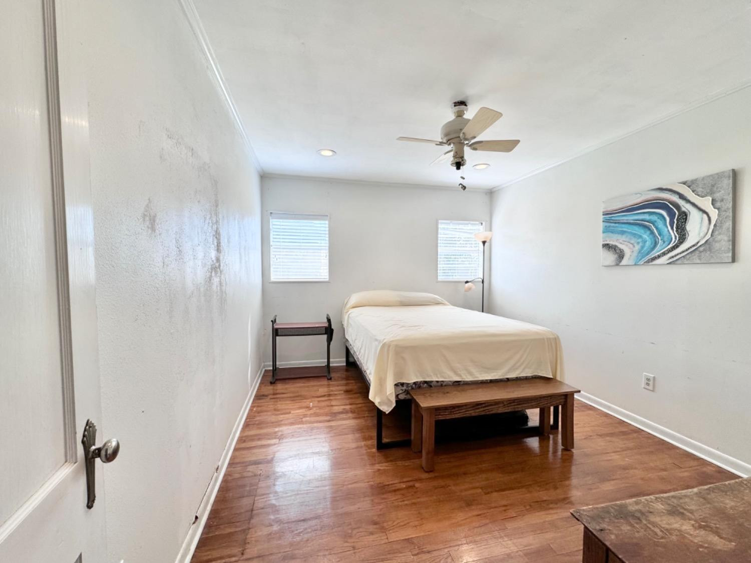 133 River Point Road Spur, TX 79370 - Photo 13 of 18 Front bedroom with hardwood floors