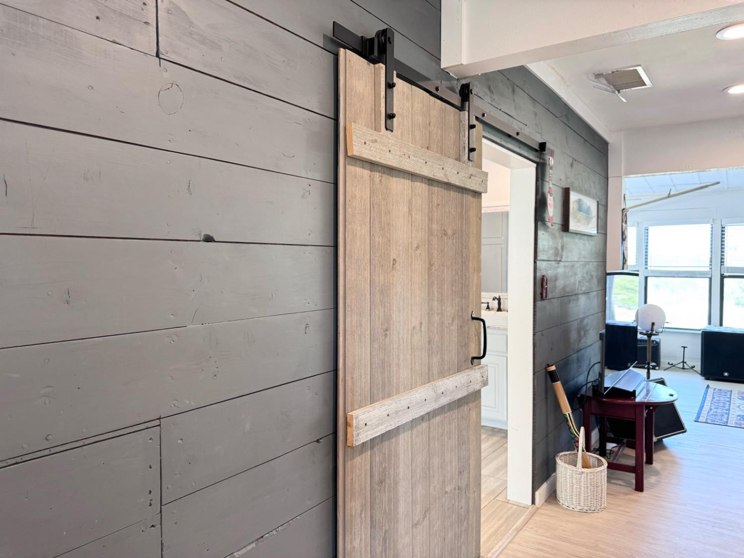 133 River Point Road Spur, TX 79370 - Photo 14 of 18 Barn door to hall bath