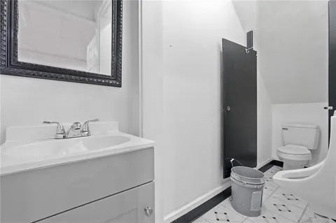 a bathroom with a sink and a toilet