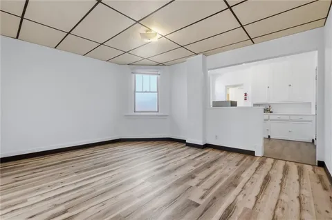 a view of a livingroom with wooden floor