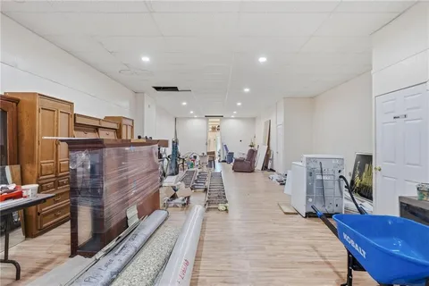 a living room with lots of furniture and kitchen view
