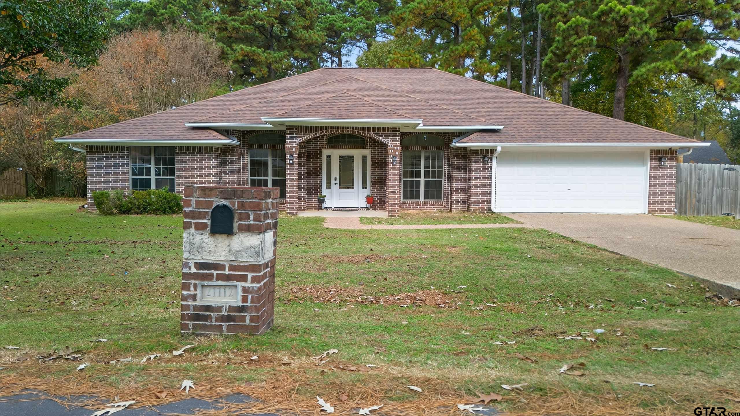 21112 Altuda Lane Flint, TX 75762 - Photo 1 of 48 a front view of a house with a garden and porch