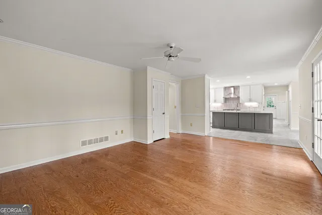 a view of a kitchen with marble kitchen and refrigerator