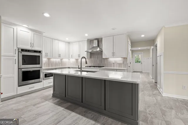 a large kitchen with cabinets