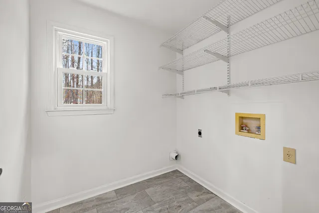 a view of empty room with windows