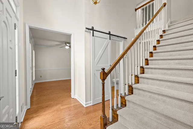 a view of staircase with wooden floor and staircase