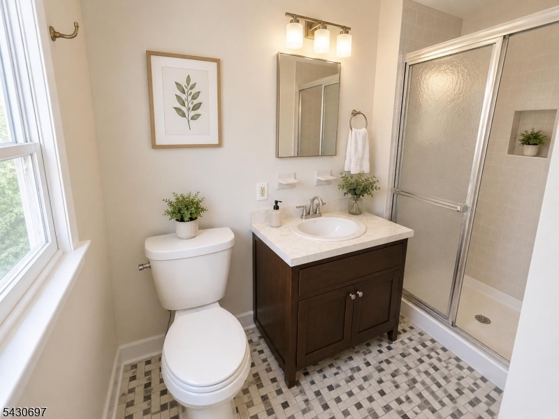 2479 Dayton Avenue Union, NJ 07083 - Photo 6 of 9 a bathroom with a toilet sink and mirror