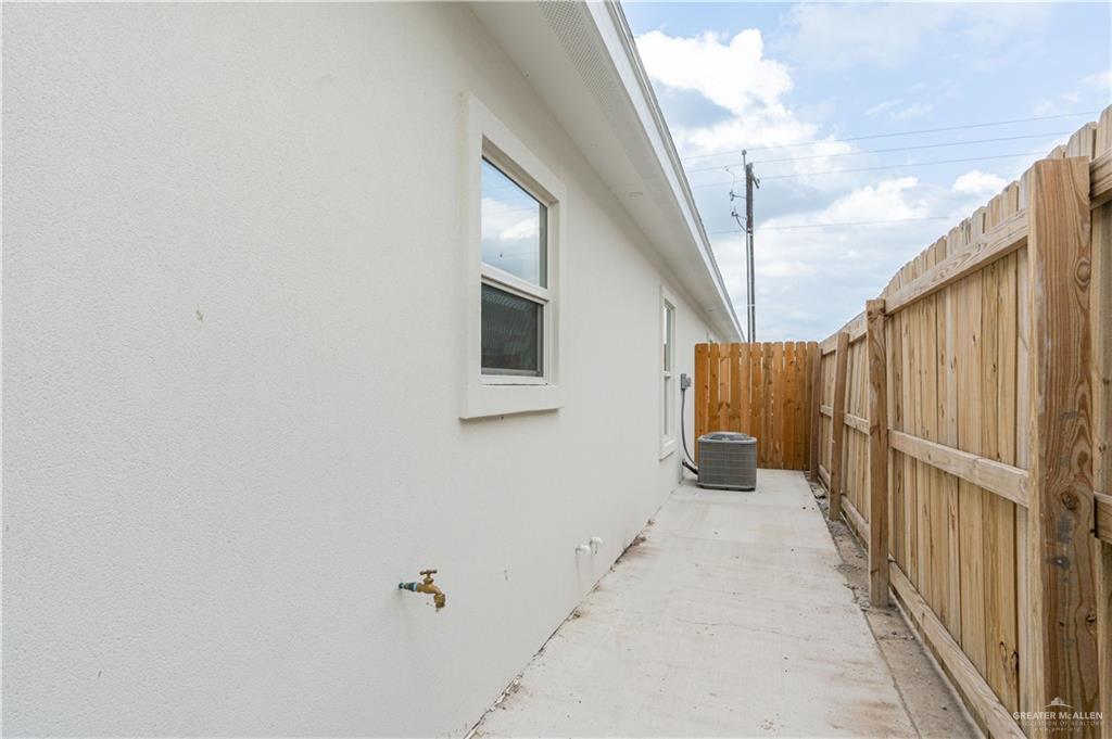 221 Rafael Drive, Unit 1 San Juan, TX 78589 - Photo 13 of 18 a view of a house with stairs and a white wall