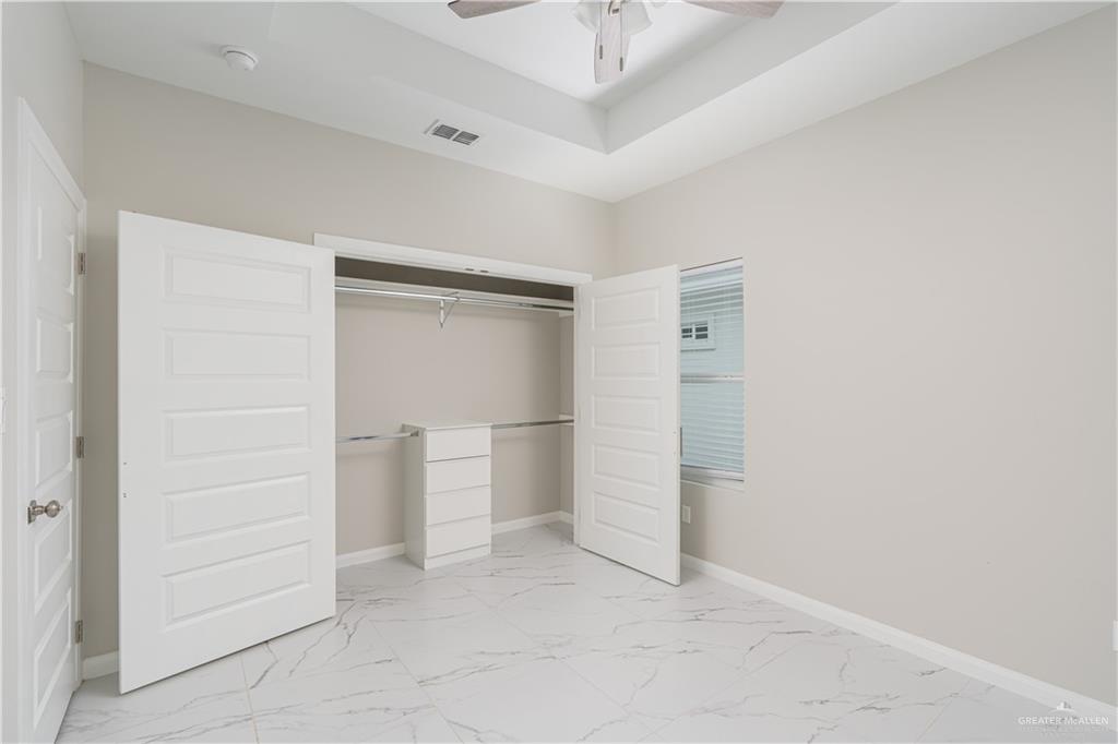 221 Rafael Drive, Unit 1 San Juan, TX 78589 - Photo 6 of 18 an empty room with closet and windows