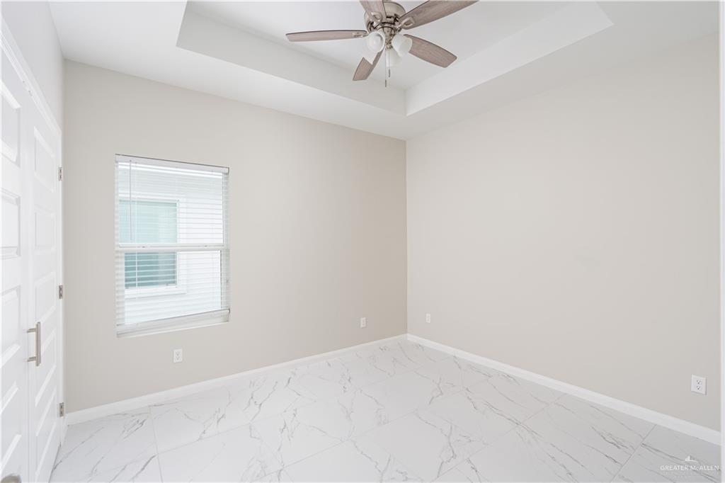 221 Rafael Drive, Unit 1 San Juan, TX 78589 - Photo 7 of 18 an empty room with a window and a fan