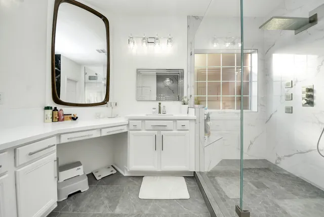 a bathroom with a sink and a mirror
