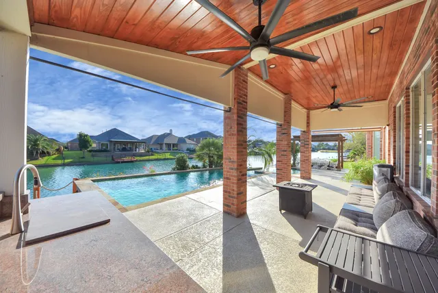 a view of swimming pool with a patio