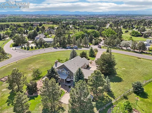 an aerial view of a house with a garden