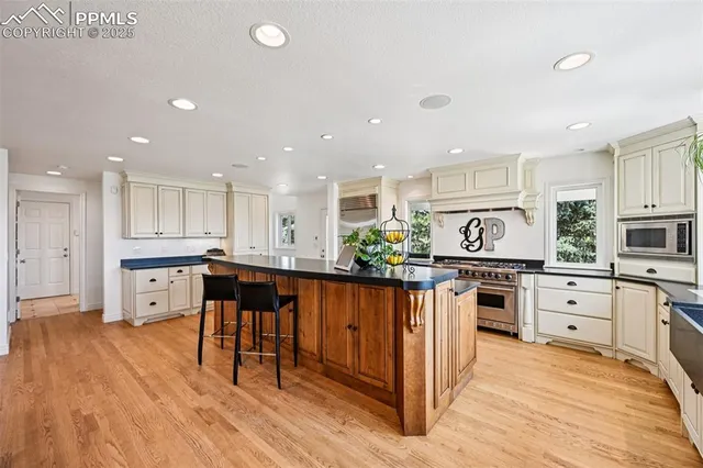 a living room with furniture and a book shelf