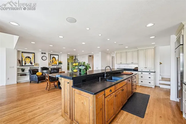 a aerial view of a house with yard porch and furniture