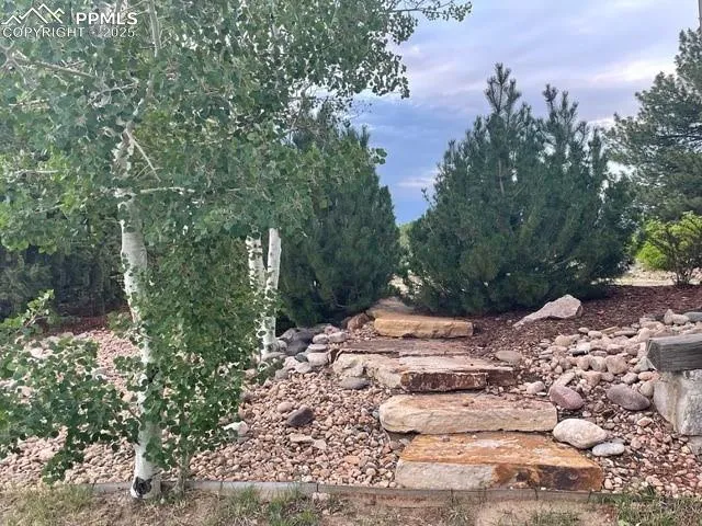 a view of a table and chairs on the roof deck