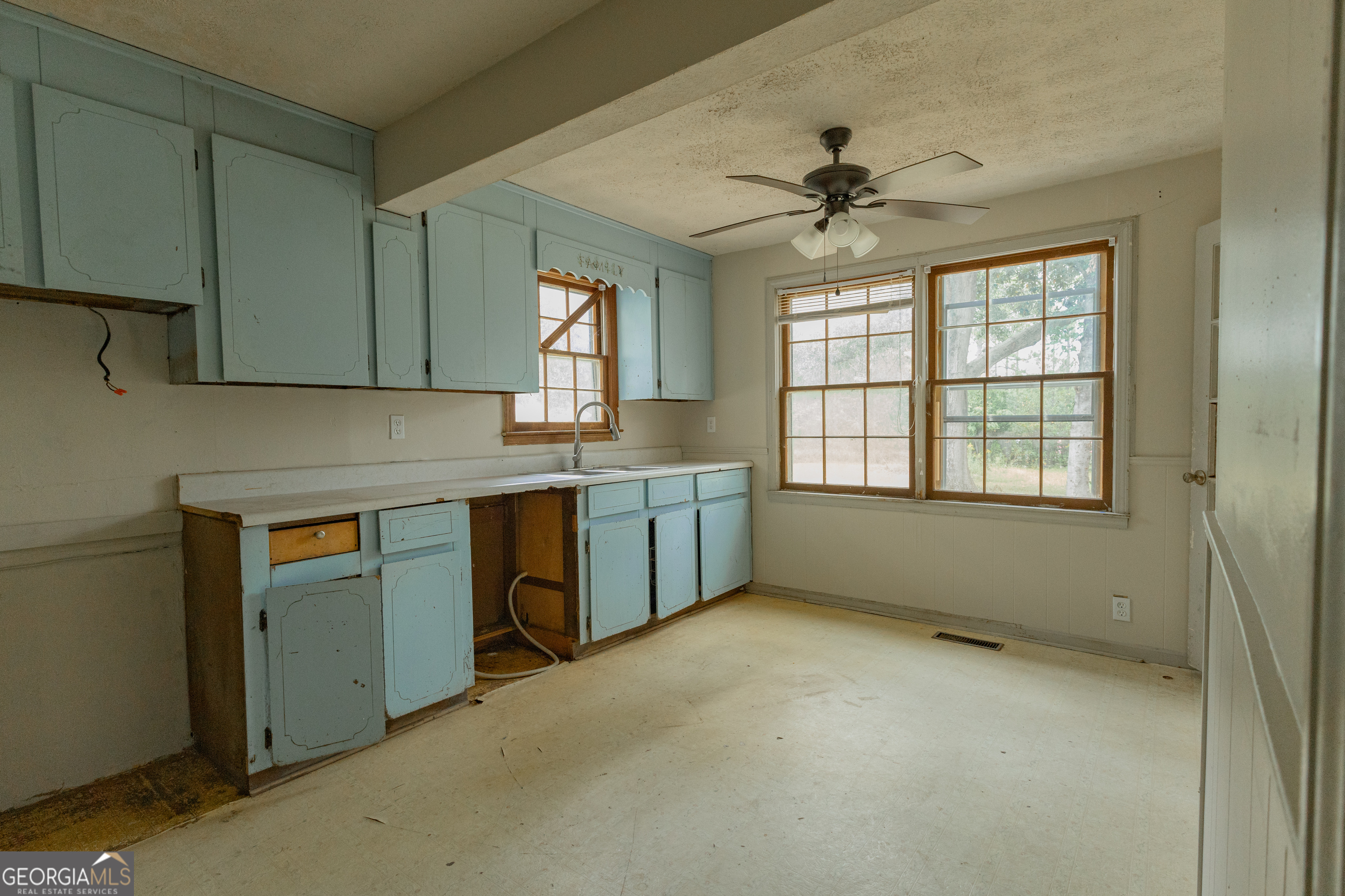 2165 Griffin Road Macon, GA 31216 - Photo 12 of 21 a kitchen with a cabinets and window