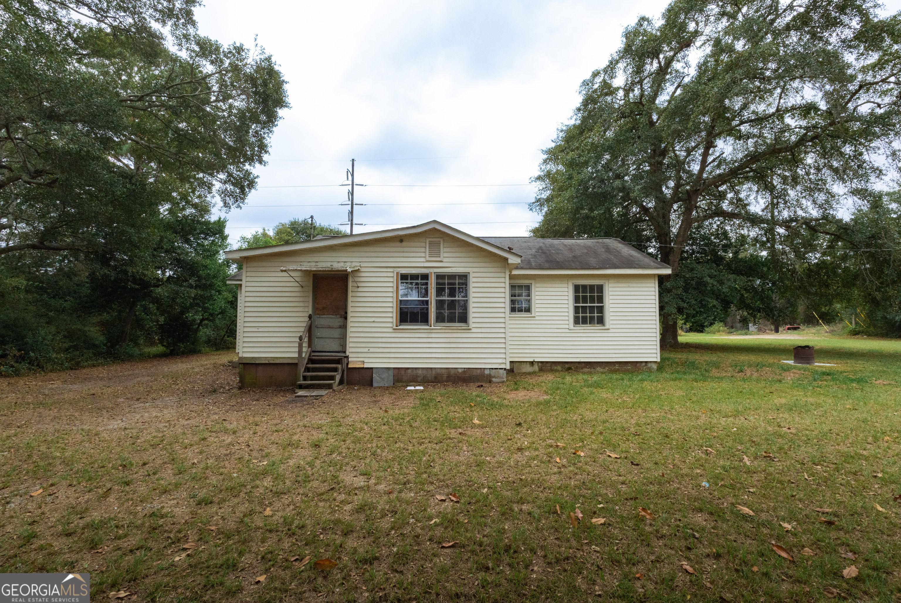 2165 Griffin Road Macon, GA 31216 - Photo 5 of 21 a view of a house with a backyard