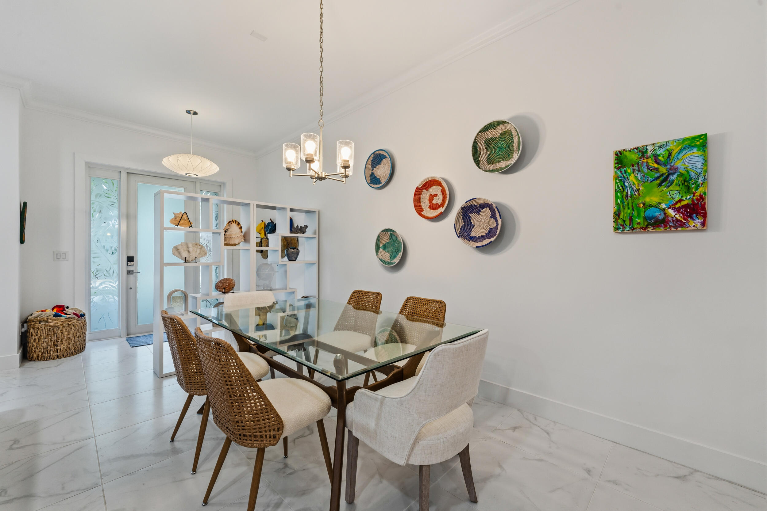 4692 Southeast Manatee Terrace Stuart, FL 34997 - Photo 13 of 47 a view of a dining room with furniture and wooden floor