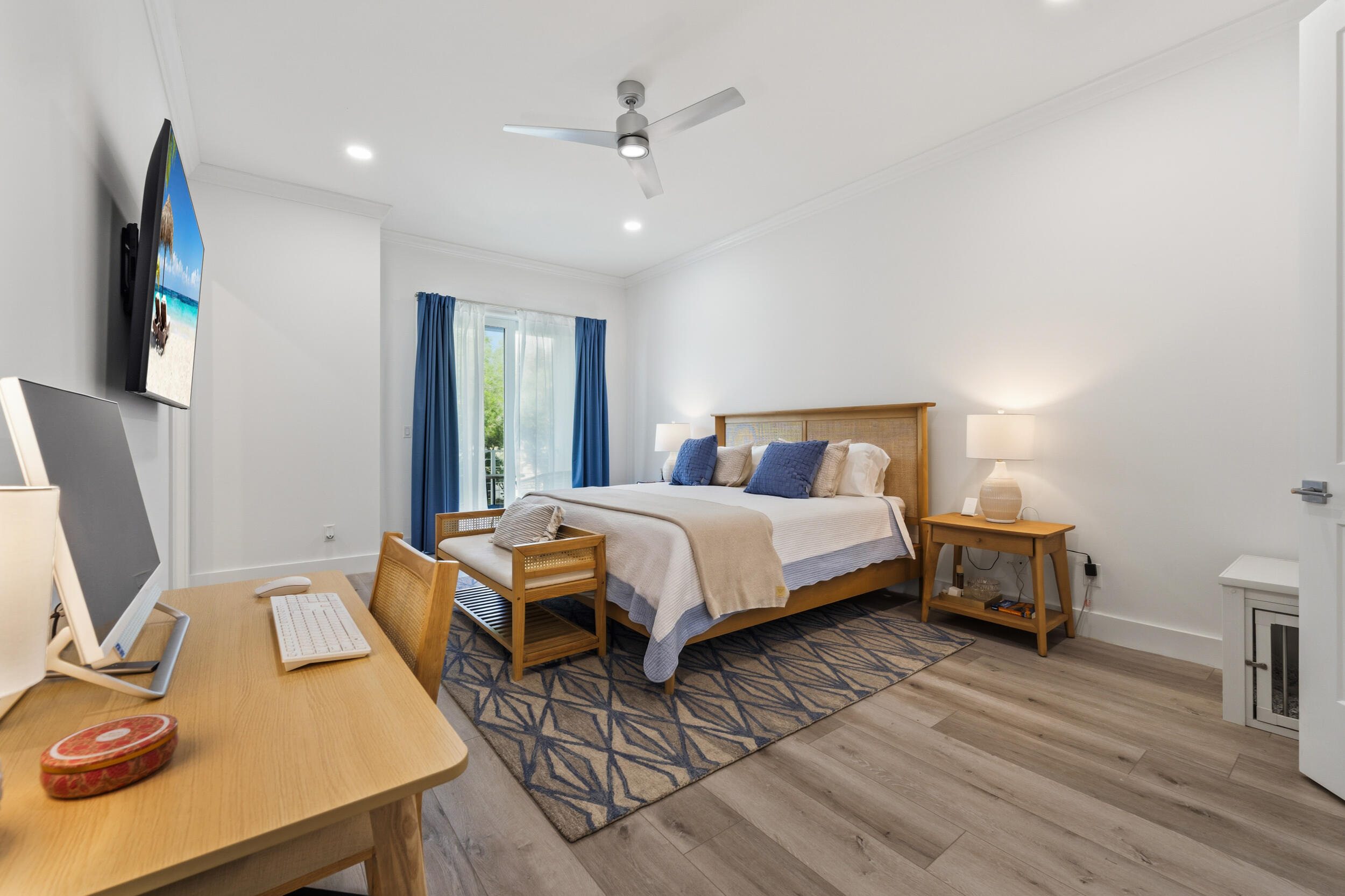 4692 Southeast Manatee Terrace Stuart, FL 34997 - Photo 16 of 47 a bedroom with a bed and a table