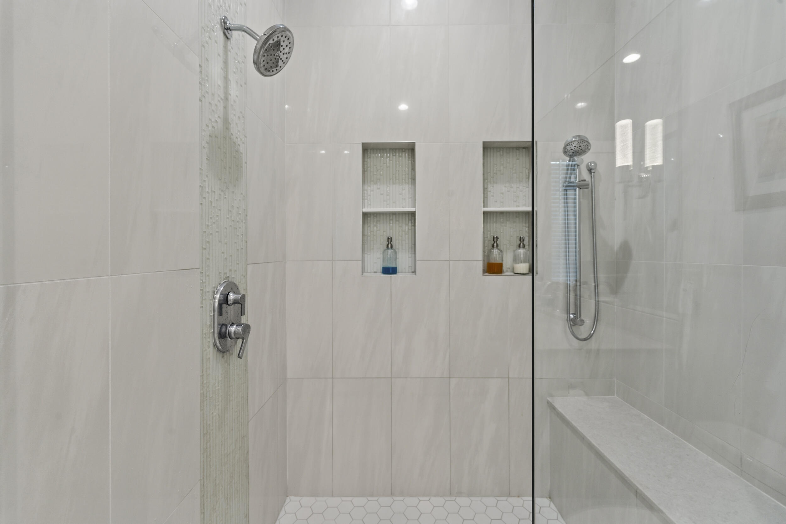 4692 Southeast Manatee Terrace Stuart, FL 34997 - Photo 21 of 47 a bathroom with a shower and a glass door