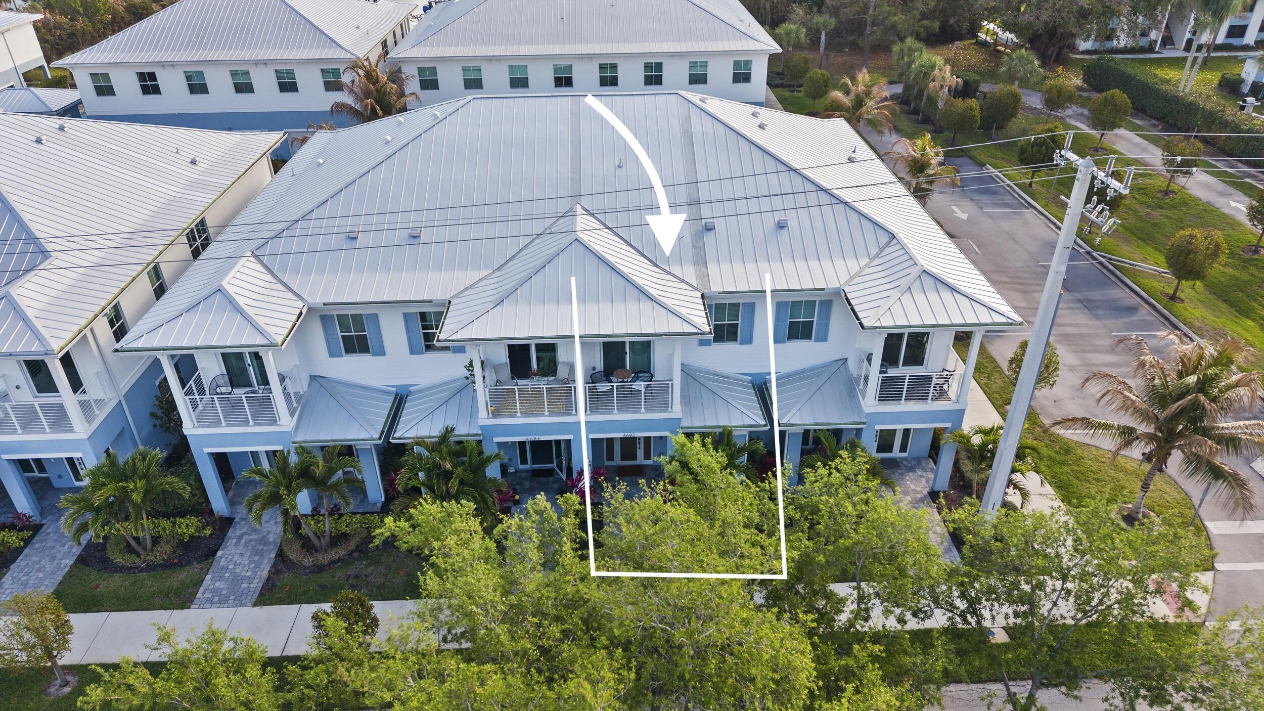 4692 Southeast Manatee Terrace Stuart, FL 34997 - Photo 34 of 47 an aerial view of a house with yard and staircase