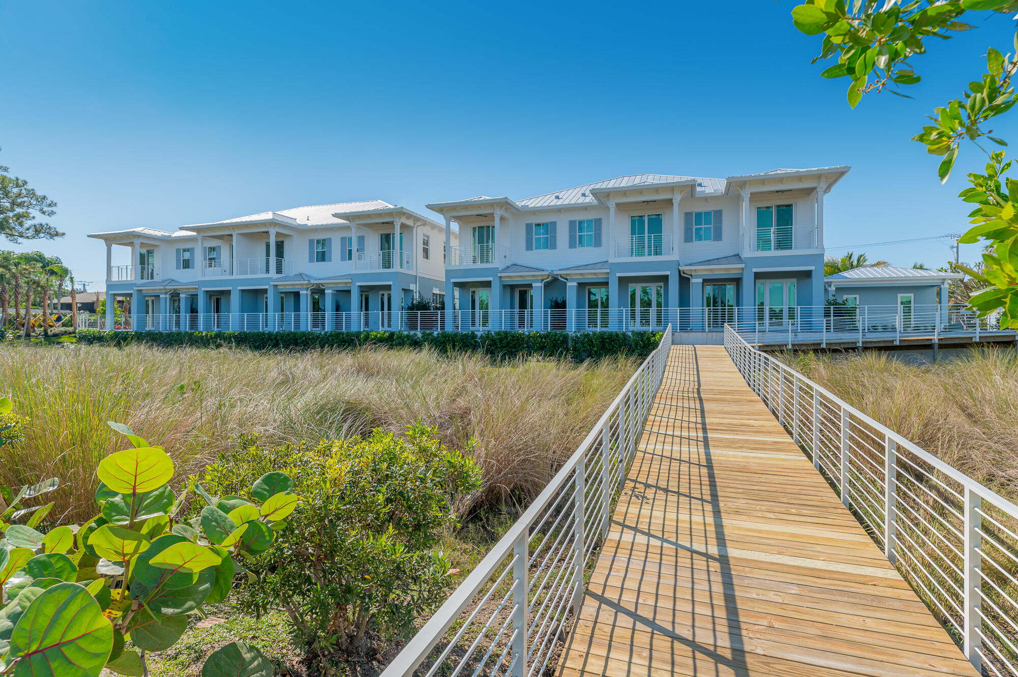 4692 Southeast Manatee Terrace Stuart, FL 34997 - Photo 37 of 47 a view of swimming pool with outdoor seating and lake view