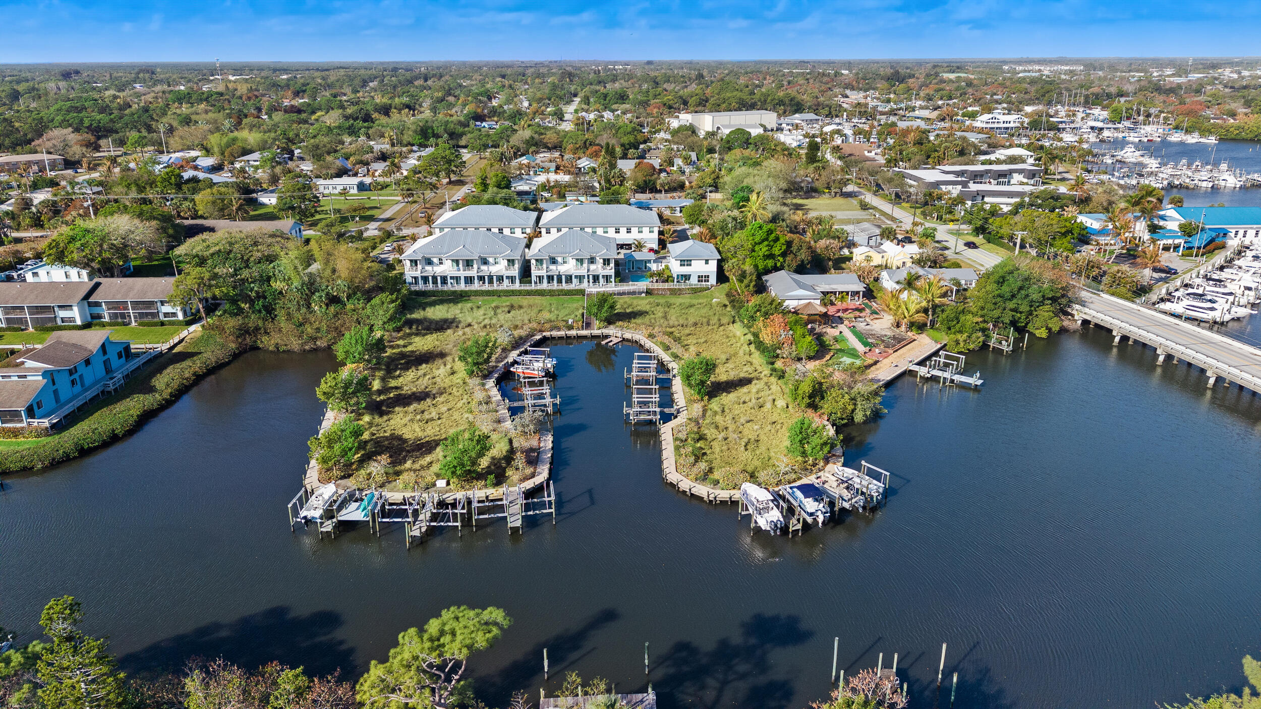 4692 Southeast Manatee Terrace Stuart, FL 34997 - Photo 39 of 47 an aerial view of a house with a lake view