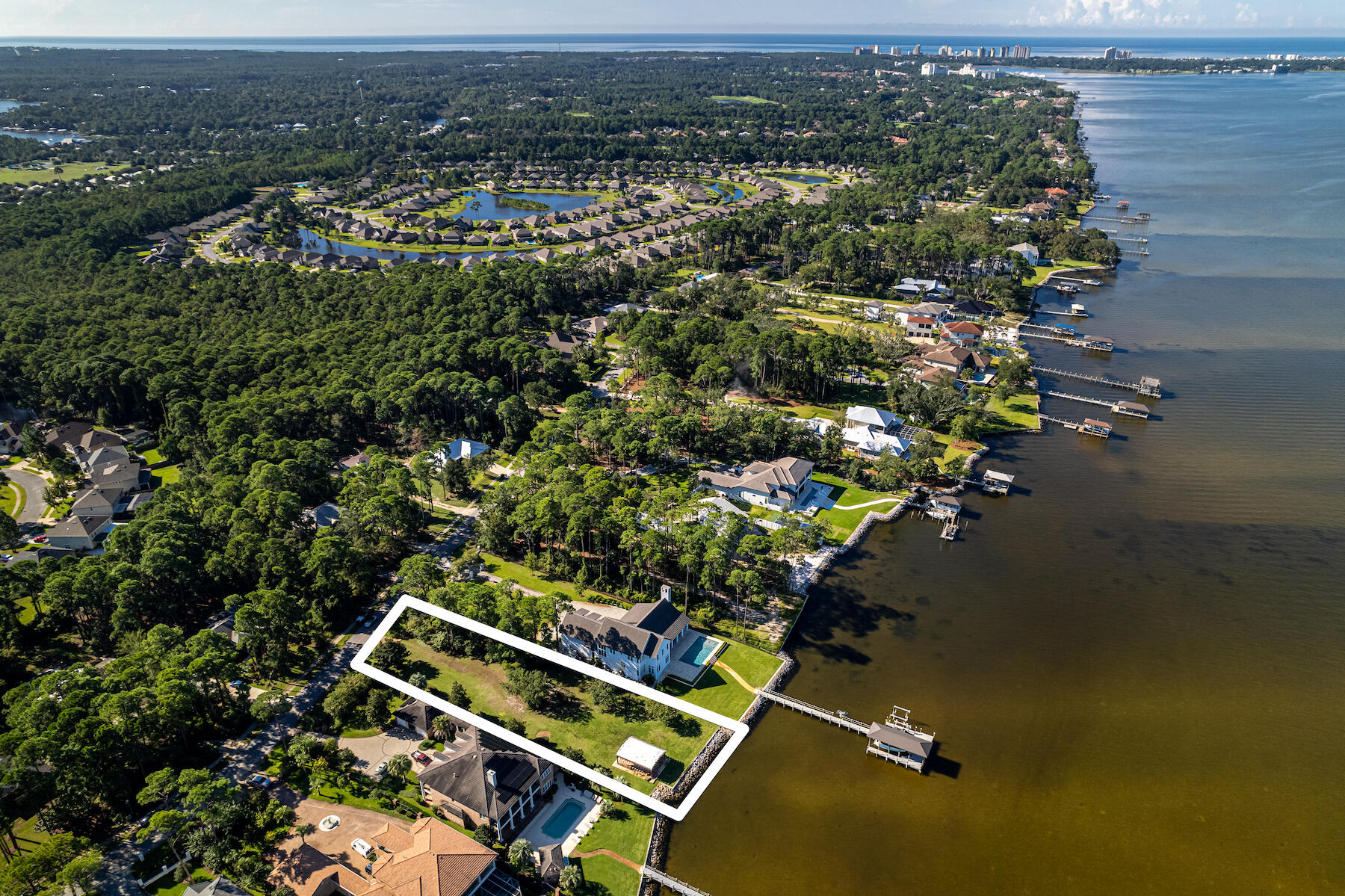 Lot 5 Driftwood Point Road Santa Rosa Beach, FL 32459 - Photo 7 of 11 an aerial view of a house with a yard and lake view