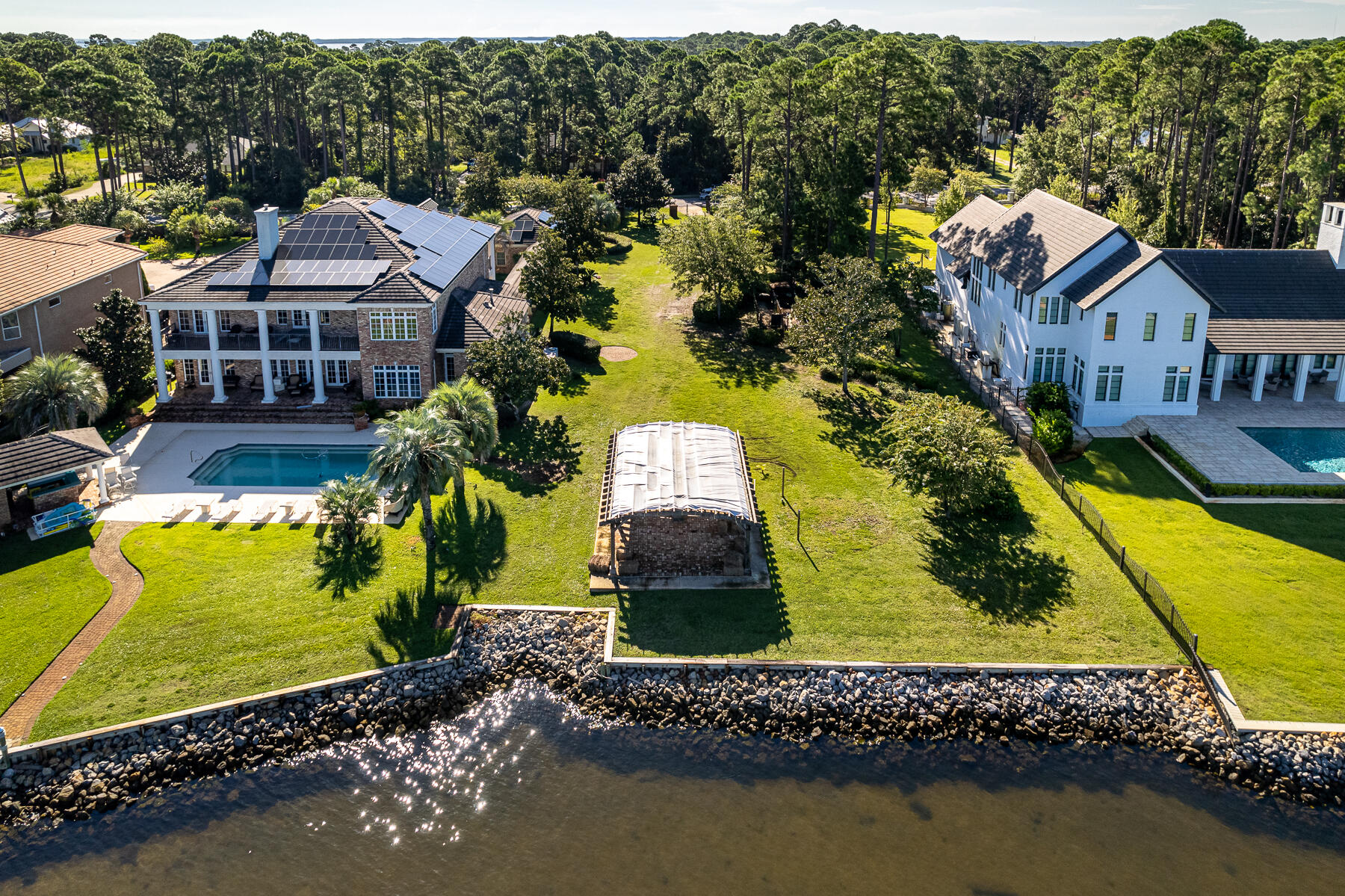 Lot 5 Driftwood Point Road Santa Rosa Beach, FL 32459 - Photo 10 of 11 an aerial view of a house with a garden and lake view