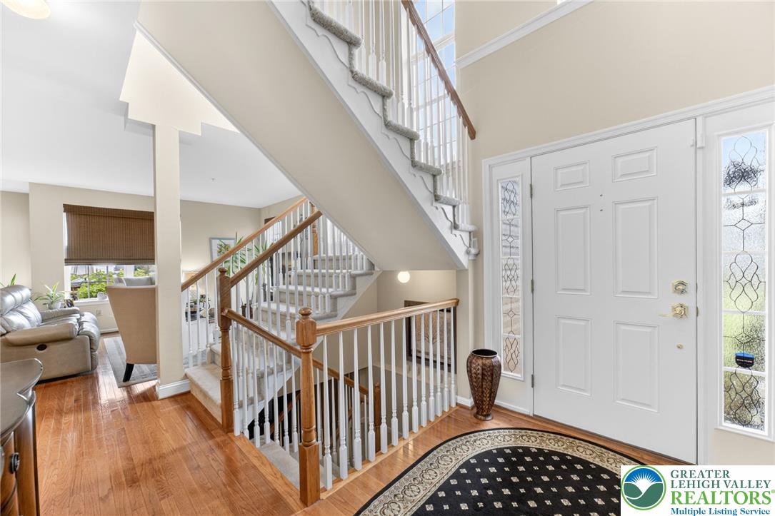 5440 Spring Ridge Drive West Macungie, PA 18062 - Photo 3 of 40 A graceful staircase ascends from the hardwood flooring of this inviting entry.