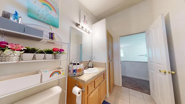 a bathroom with a sink a vanity and a mirror