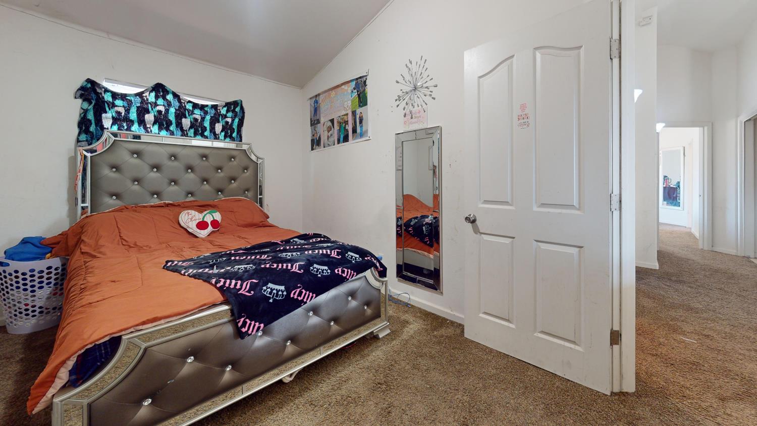 185 River Pointe Madera, CA 93637 - Photo 21 of 36 a bedroom with a bed and a painting on the wall