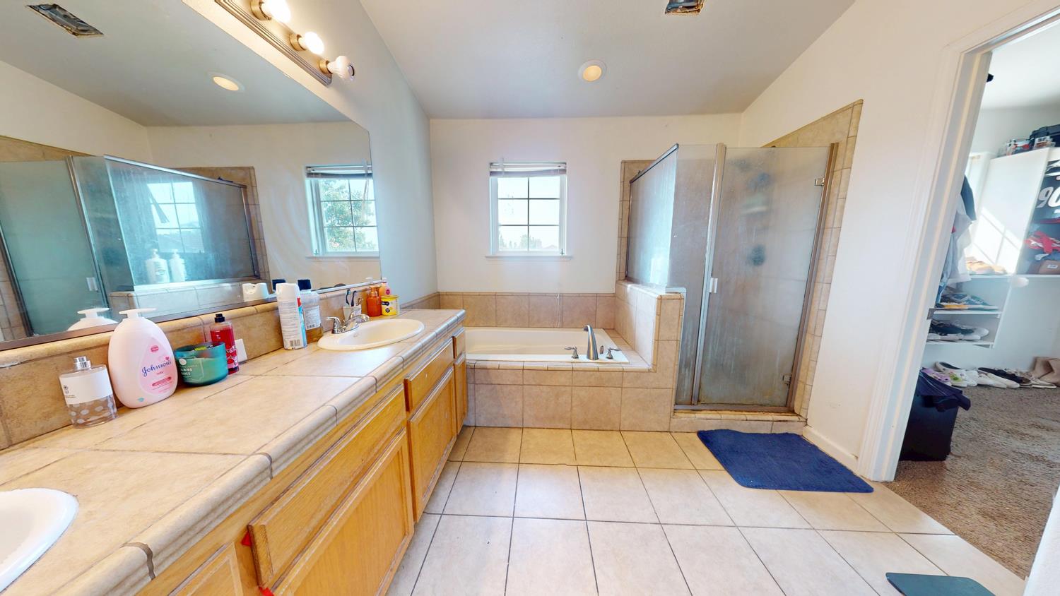 185 River Pointe Madera, CA 93637 - Photo 28 of 36 a kitchen with a sink and a refrigerator