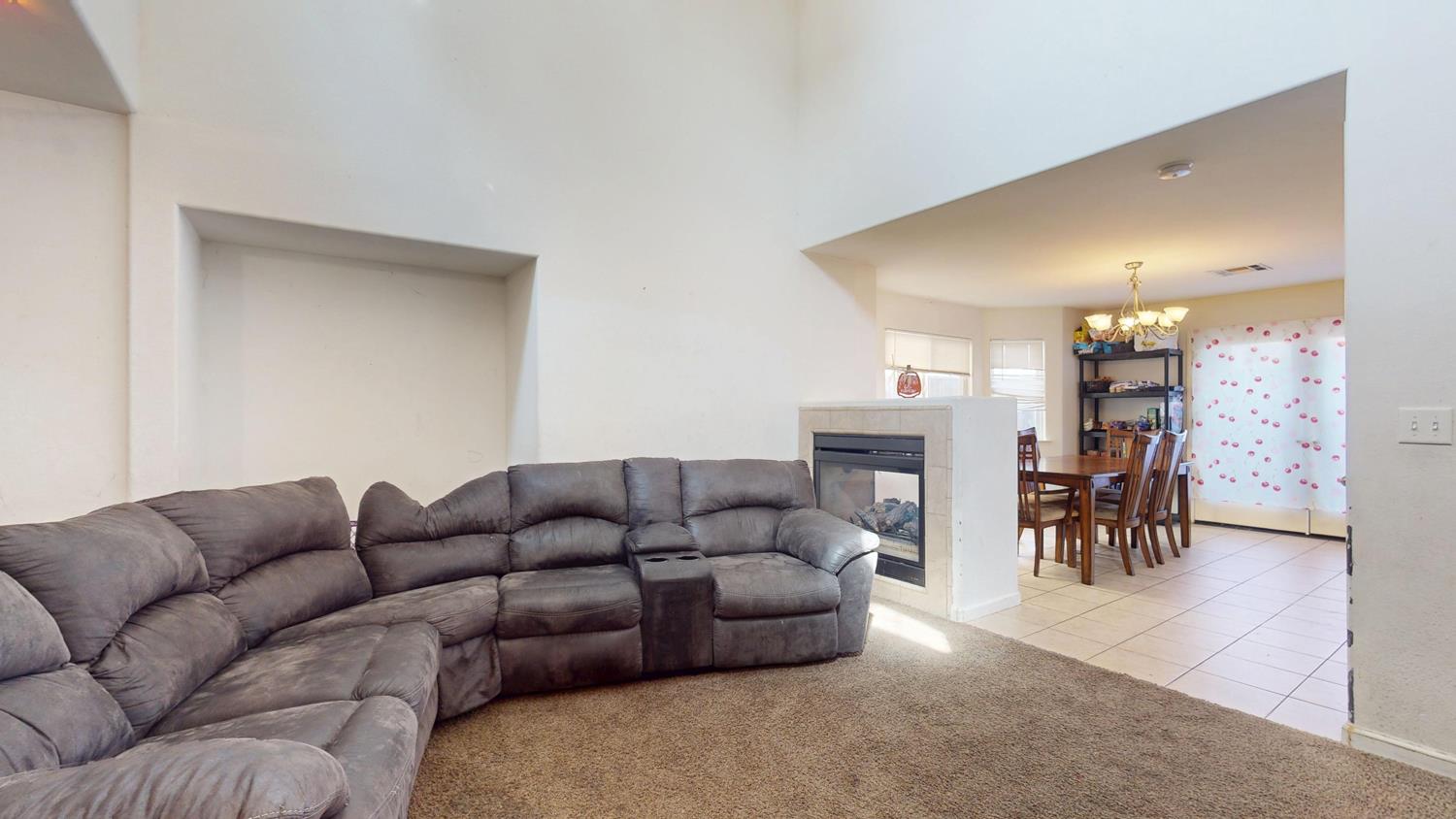 185 River Pointe Madera, CA 93637 - Photo 6 of 36 a living room with furniture and a fireplace