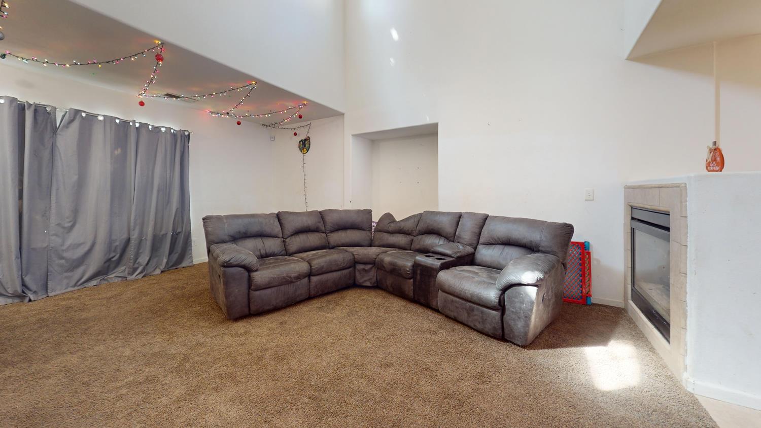 185 River Pointe Madera, CA 93637 - Photo 7 of 36 a living room with furniture a couch and a ceiling fan
