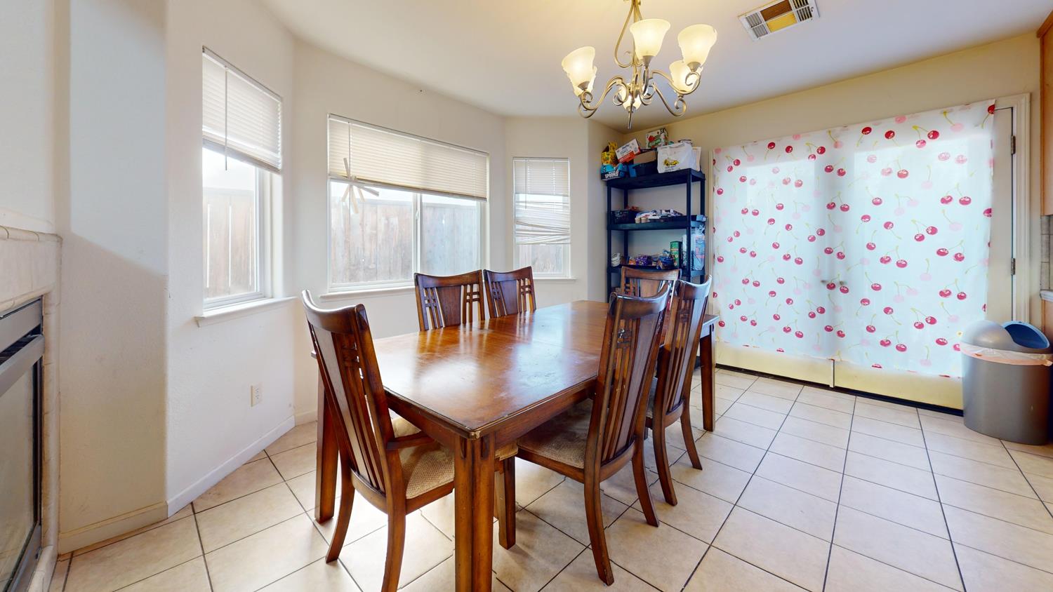 185 River Pointe Madera, CA 93637 - Photo 10 of 36 a view of a dining room with furniture and chandelier