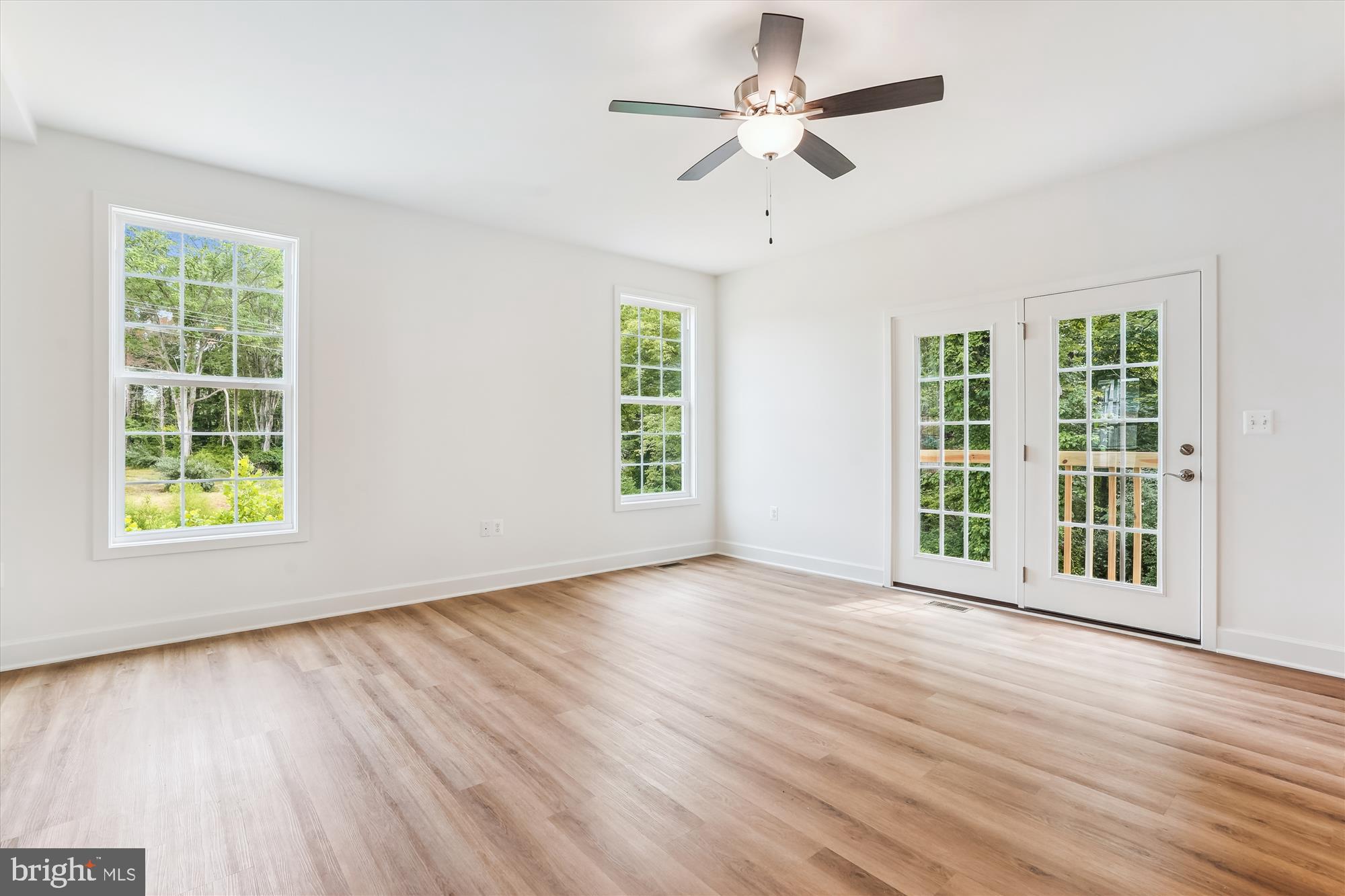 13053 Korea Road Amissville, VA 20106 - Photo 15 of 66 a view of an empty room with wooden floor and a window