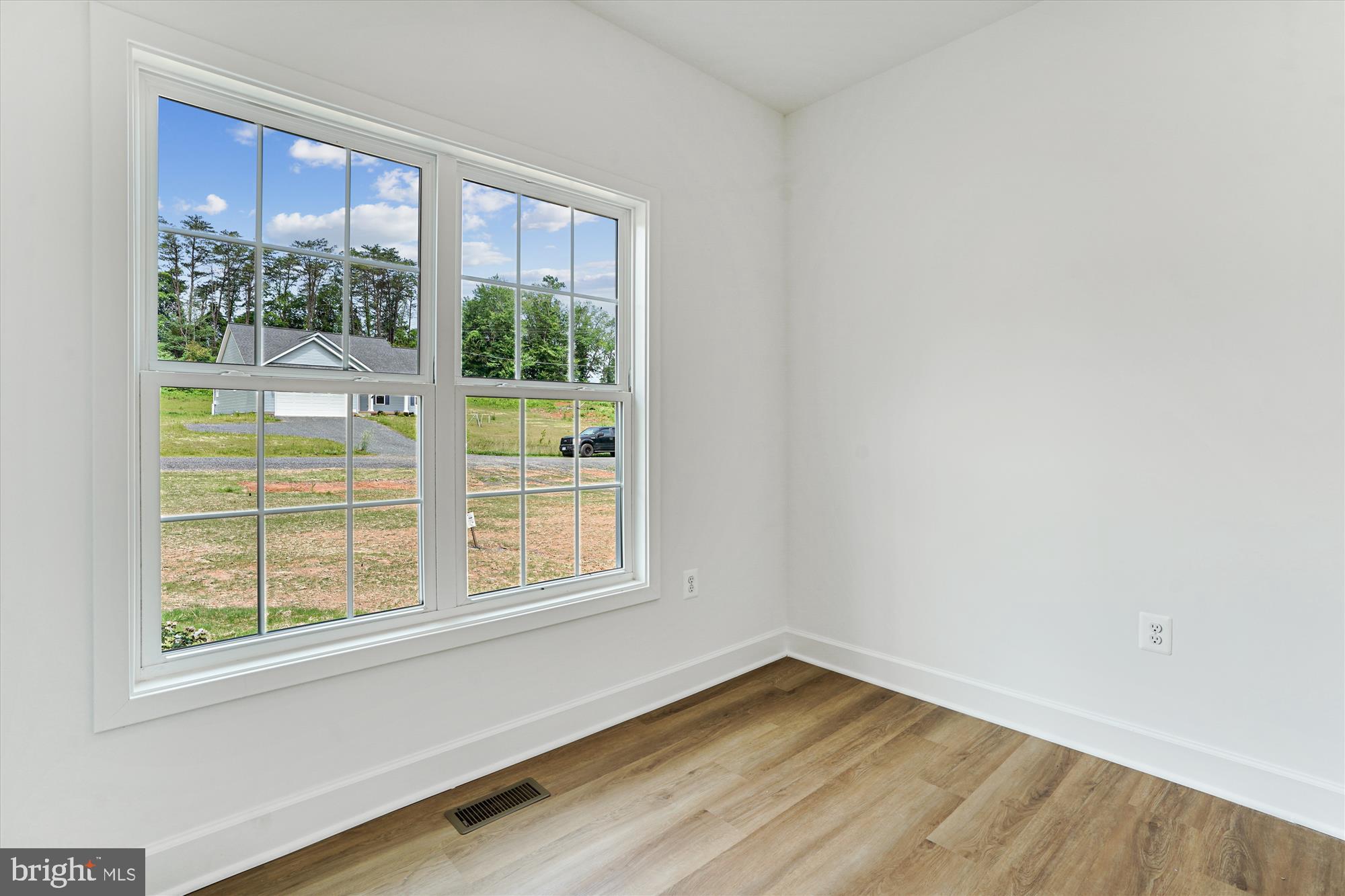 13053 Korea Road Amissville, VA 20106 - Photo 18 of 66 a view of an empty room with wooden floor and a window