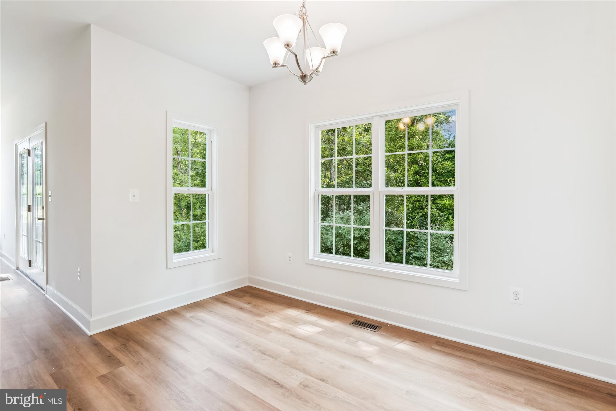 13053 Korea Road Amissville, VA 20106 - Photo 23 of 66 an empty room with wooden floor cabinet and windows