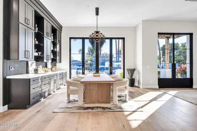 a living room with fireplace furniture and floor to ceiling window