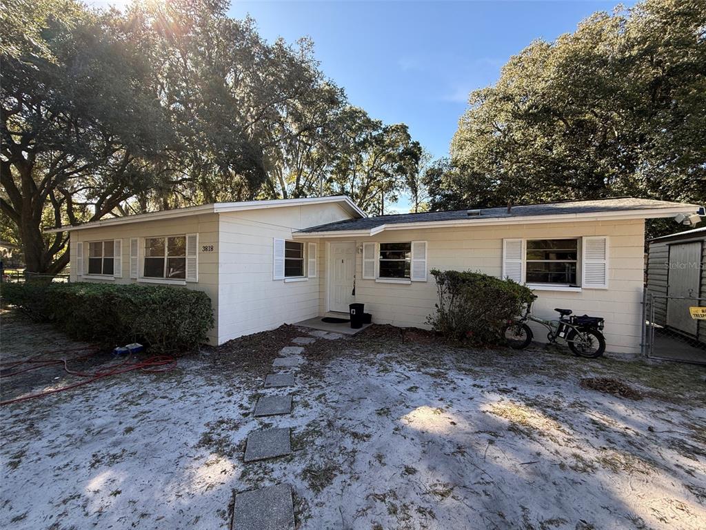 3818 Northeast 13th Drive Gainesville, FL 32609 - Photo 2 of 12 a view of a house with a patio