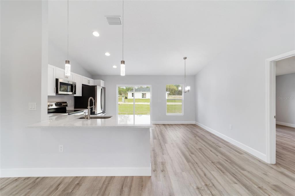2871 Southwest 147th Terrace Ocala, FL 34481 - Photo 14 of 44 a view of a kitchen with a sink and a window