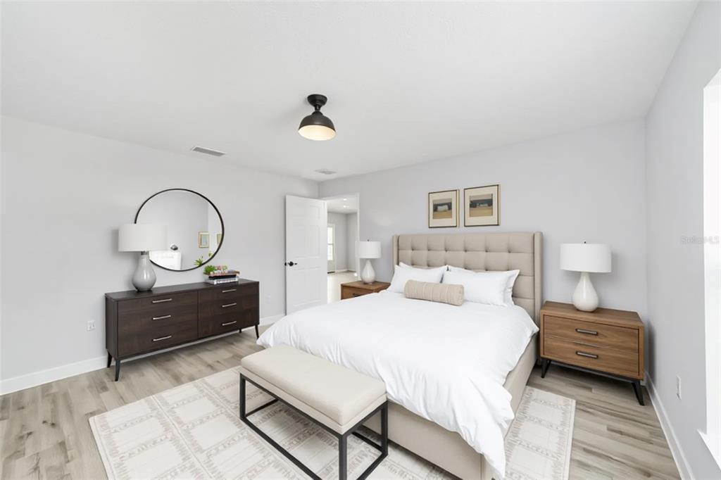 2871 Southwest 147th Terrace Ocala, FL 34481 - Photo 22 of 44 a bedroom with a bed window and a dresser